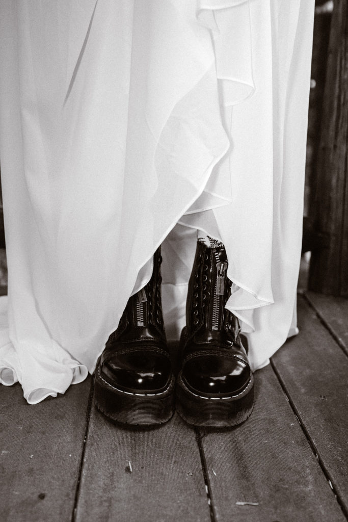Shot of brides doc martins under her wedding dress for her mt. Rainier wedding