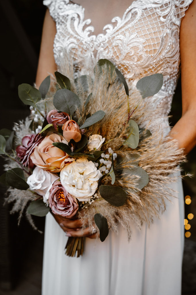 Shot of bride holding her boho floral bouquet during her mt. rainier wedding