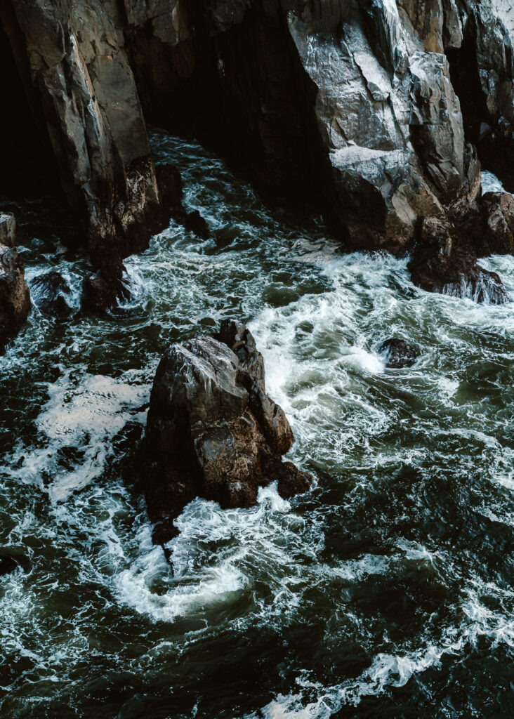 an image of jagged basalt stacks, jutting up from the icy blue pacific made up the scenery for this couples coastal elopement.