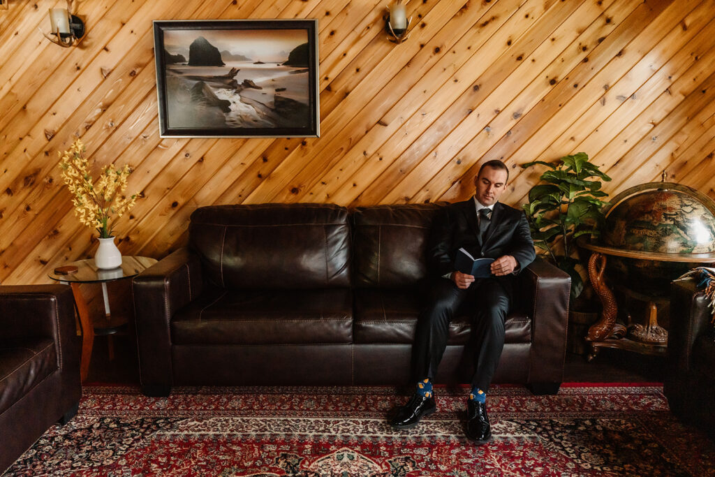 a groom reads over his vows before sharing a private first look with his bride. 