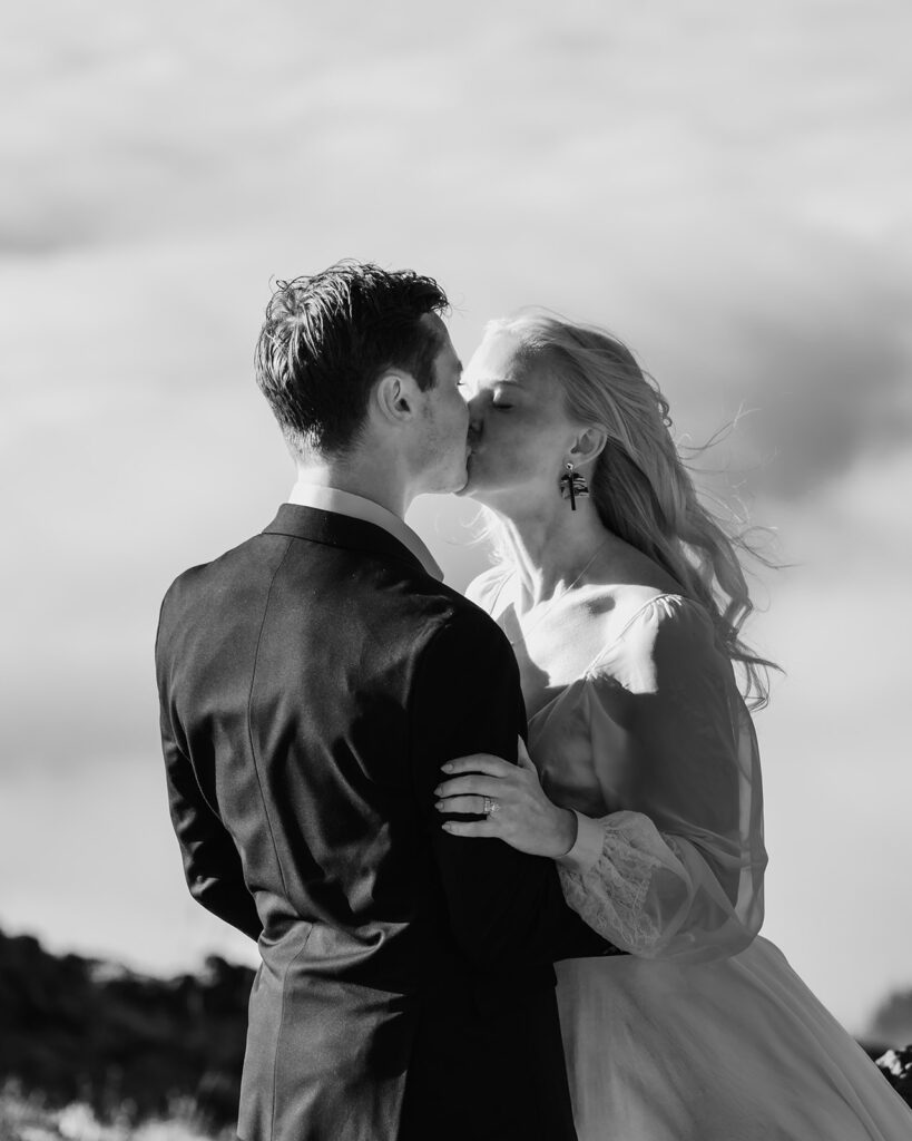 a black and white photo of a bride and groom kissing after their Olympic Peninsula elopement ceremony 