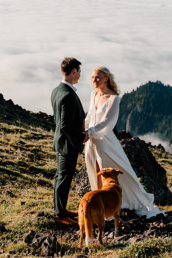 a bride smiles widely at her groom during their Olympic Peninsula elopement. 