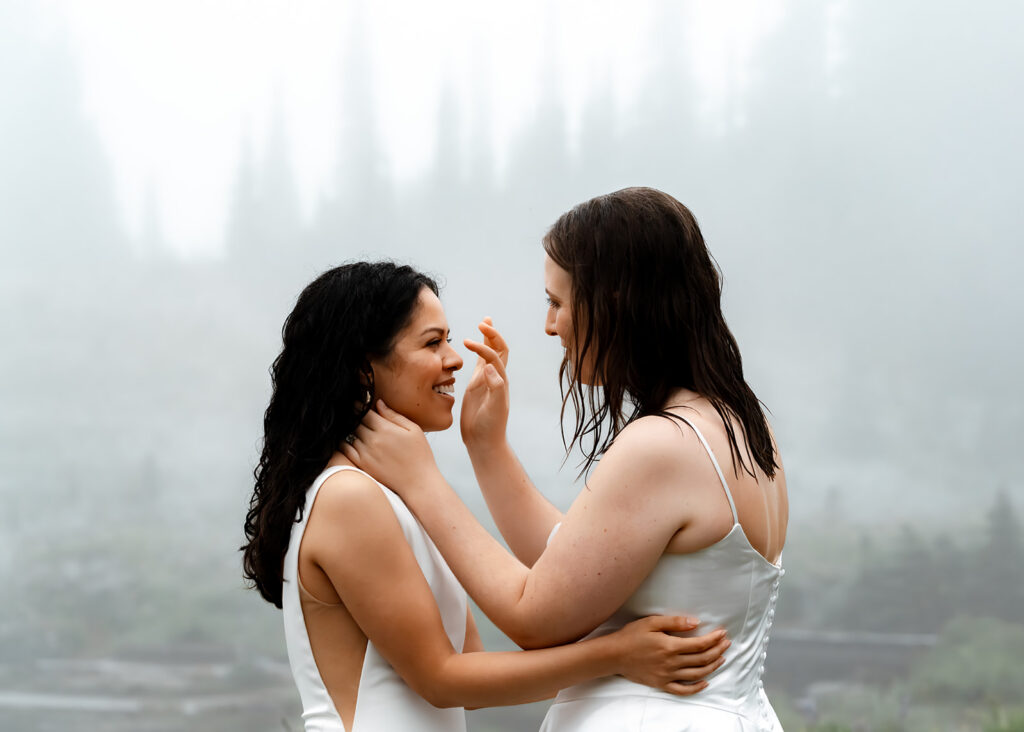 a bride traces the face of her bride during their tipsoo elopment 