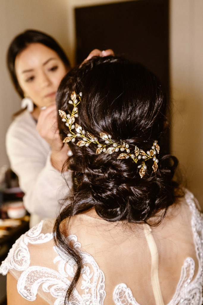 Shot of brides hair piece, detailed with golden leaves and pearls during her Mt Rainier Wedding