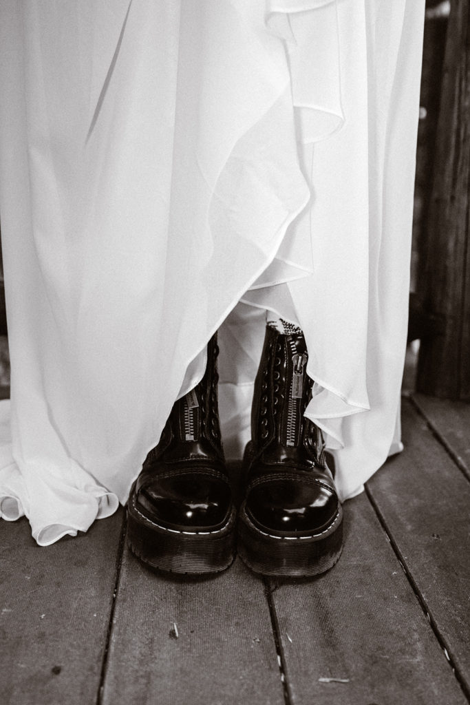 Shot of brides doc martins under her wedding dress for her mt. Rainier wedding 