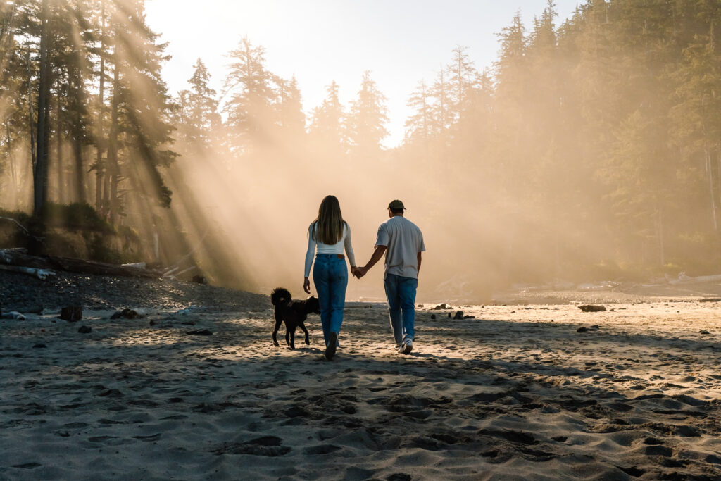 During the morning of their coastal elopement, the soon to be newlyweds explore a sandy beach surrounded by hazy, golden sunlight. 
