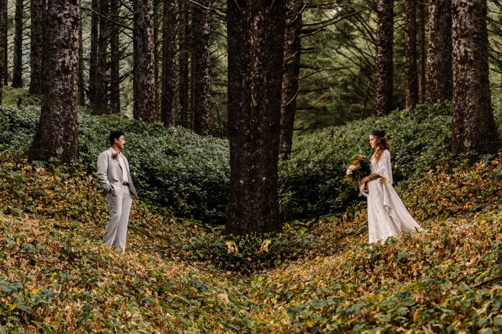 a beautifully composed parallel image of a couple standing in lush, coastal greenery before their surfer wedding.