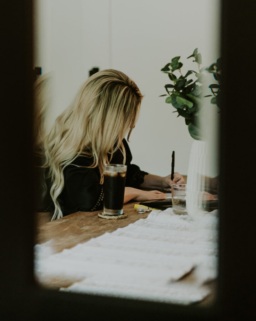 an image shot in a mirror of a bride writing her vows for her mount baker elopement