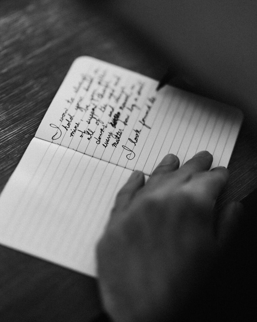 shot from his perspective, a close up image of a groom writing his vows for their mount baker elopement